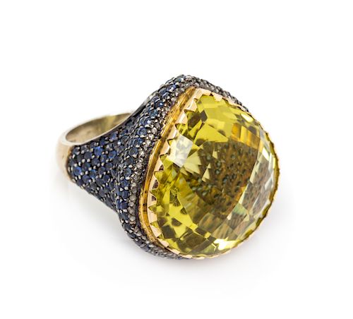 A Gilt Silver, Lemon Quartz and Sapphire Ring, 12.40 dwts.