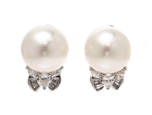 A Pair of 18 Karat White Gold, Cultured Pearl, and Diamond Earclips, 5.10 dwts.