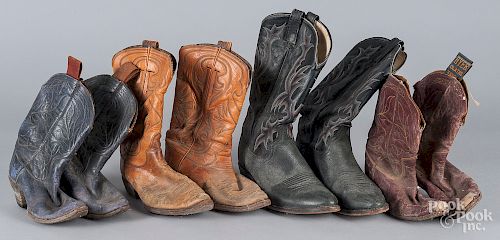 Four pairs of vintage cowboy boots.