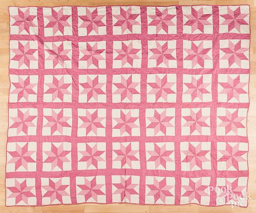 Pink and white star quilt