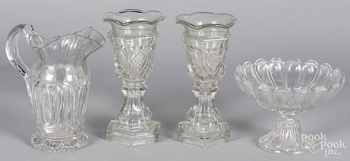 Three pieces of pressed glass and a pitcher
