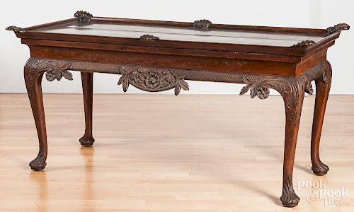 Heavily carved walnut library table