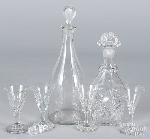 Two colorless glass decanters