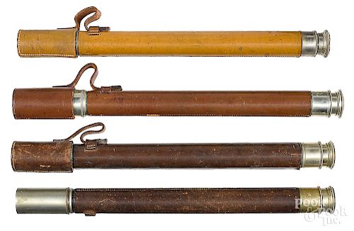 Four leather encased single draw telescopes