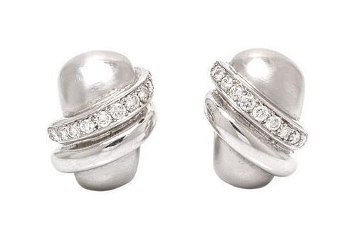 A Pair of 18 Karat White Gold and Diamond Ear Clips, 14.10 dwts.