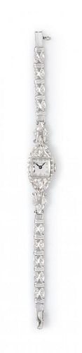 A Vintage 14 Karat White Gold Diamond Wristwatch, Bulova, 10.50 dwts.