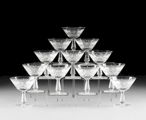 A SET OF TWELVE WATERFORD CUT CRYSTAL CHAMPAGNE/TALL SHERBET GLASSES IN THE "KENMARE" PATTERN, DESIGNED CIRCA 1968,