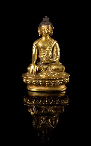 A Small Sino-Tibetan Gilt Bronze Figure of Buddha