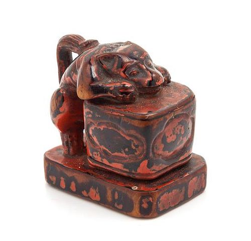 A Japanese Lacquered Wood Netsuke Height 1 1/4 inches.