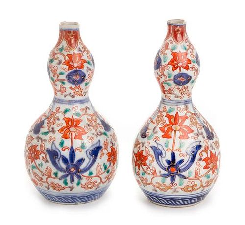 A Pair of Japanese Imari Porcelain Sake Bottles Height of each 6 inches.