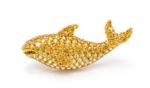 * An 18 Karat Yellow Gold, Yellow Sapphire and Diamond Orca Brooch, 8.50 dwts.