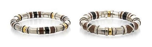 A Pair of Sterling Silver, Gold Tone and Enamel Bangles, 53.10 dwts.