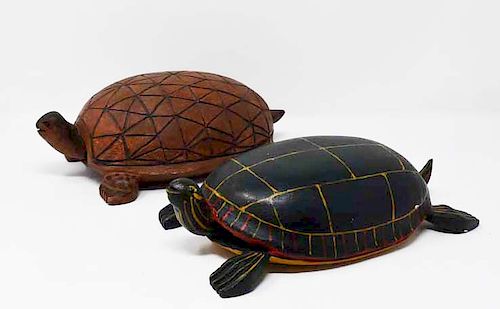 2 carved wooden turtles