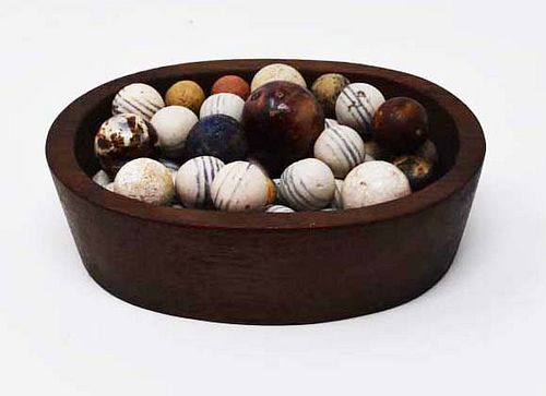 Walnut oval bowl w/approximately 43 clay marbles