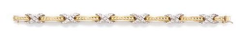 * A 14 Karat Gold and Diamond Bracelet, 19.90 dwts.