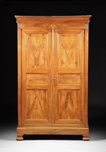 A FRENCH PROVINCIAL CARVED CHERRY ARMOIRE, EARLY 19TH CENTURY,