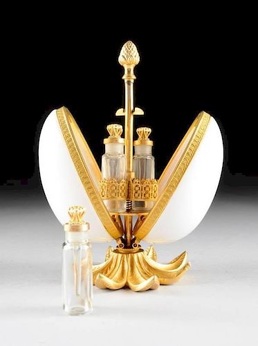 A FRENCH WHITE OPALINE GLASS EGG-SHAPED FITTED MECHANICAL SCENT CASKET, PROBABLY PARIS, CIRCA 1880,