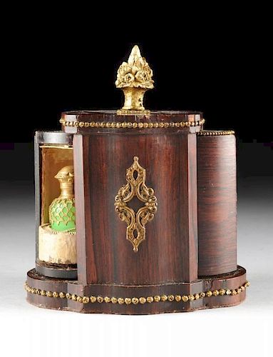 A FRENCH ROSEWOOD VENEER AND GILT BRONZE  MECHANICAL REVOLVING TWO BOTTLE PERFUME BOX, PROBABLY PARIS, CIRCA 1860