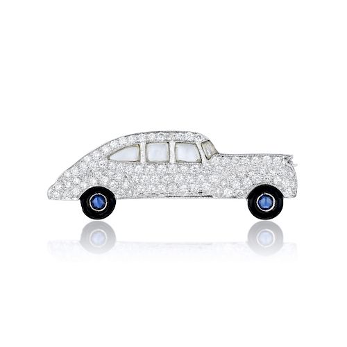 A Diamond Automobile Brooch with Sapphire Wheels