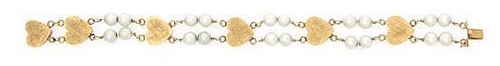 * A 14 Karat Yellow Gold and Double Strand Cultured Pearl Bracelet, 10.10 dwts.