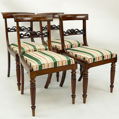 Set of Four (4) Antique English Regency style Carved Mahogany and Upholstered Side Chairs. Pierced splats and stands on tapered legs with molded front
