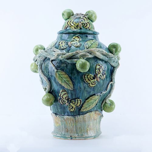 Macario Covarrubia, Mexican (20th C) High relief dome lidded ceramic urn. With applied apples, twisted vine branches and butterfly motif.