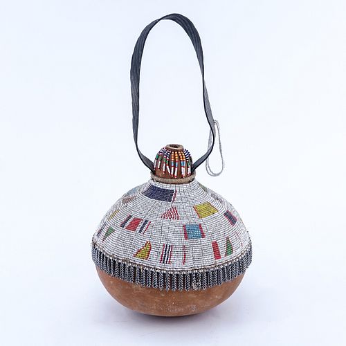 Antique African Beaded Gourd Calabash with Leather Handle, Possibly from the Zulu Tribe. Typical fraying overall good condition.