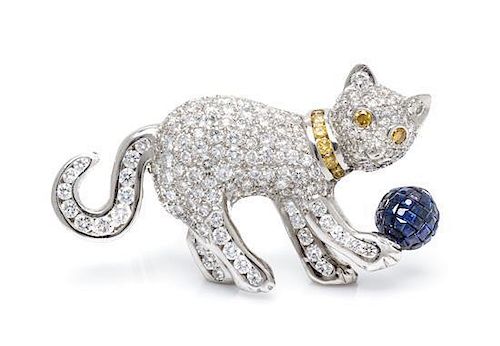 A Platinum, Diamond, Colored Diamond and Invisibly Set Sapphire Cat Brooch, 19.10 dwts.