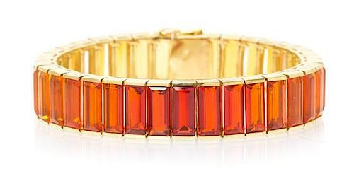 An 18 Karat Yellow Gold and Fire Opal Line Bracelet, 41.90 dwts.