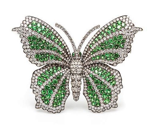 An 18 Karat White Gold, Green Garnet and Diamond Butterfly Brooch, 21.60 dwts.