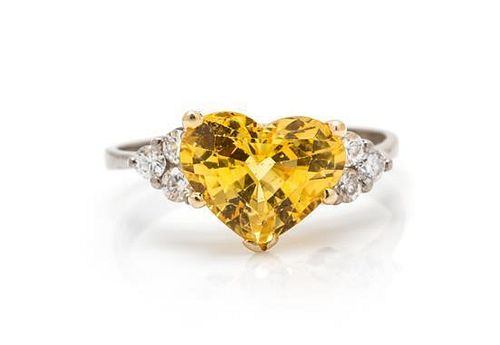 A Platinum, 18 Karat Yellow Gold, Yellow Sapphire and Diamond Ring, 1.80 dwts.