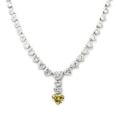 A Fine Platinum, Diamond and Fancy Deep Yellow Diamond Necklace, 38.40 dwts.