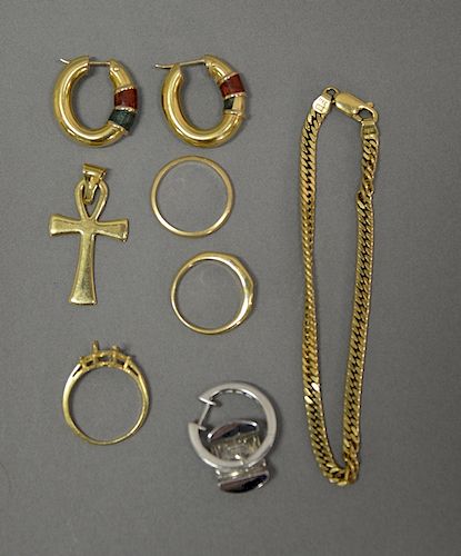 18 karat gold lot with earrings, ring, and bracelet. 28.9 grams