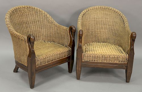 Pair of wicker armchairs with swan's head handrests.