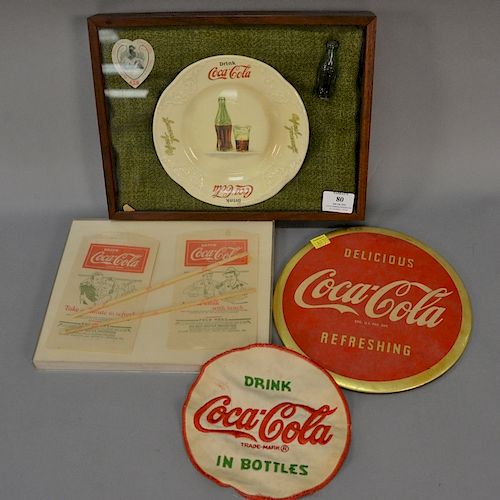 Assorted group of Coca-Cola memorabilia including Coca-Cola collectible framed group with plate, small bottle, and bookmark; a Coca-...