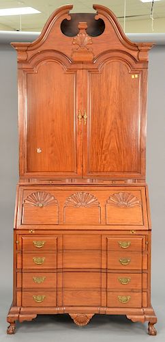 Custom mahogany secretary desk having bonnet two door bookcase top with fitted and shell carved interior on shell carved slant/block...