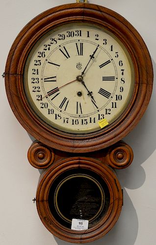 Figure eight oak calendar clock. ht. 21 1/2in.