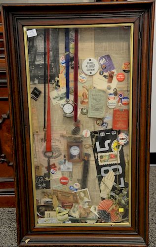 Two collage boxes including a framed shadow box with pocket watches, pins, license plates, ephemera, etc., and the other with advert...