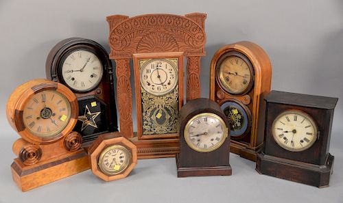 Seven piece lot to include six shelf clocks and one small wall clock. heights 6 1/2in. to 23in.