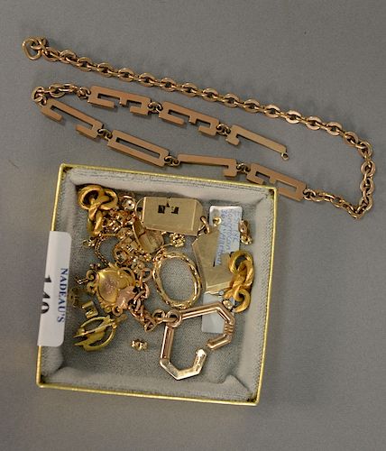 Group of miscellaneous gold and miscellaneous items to include watch chain, earring backs, pins, etc. 35.4 grams.