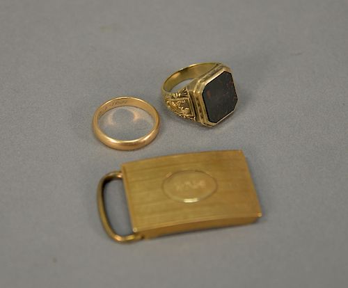 Two 14 karat gold mans rings, one mounted with bloodstone and belt buckle. 31.4 grams
