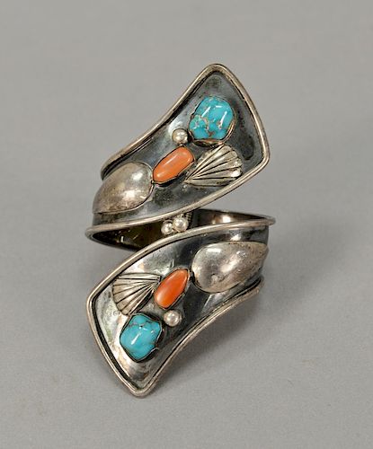 Silver bracelet set with turquoise and coral (hinged).