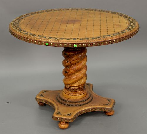 Custom round tooled leather center table having beaded center, surrounded ring with bull lead brass mounts over twist pedestal base....