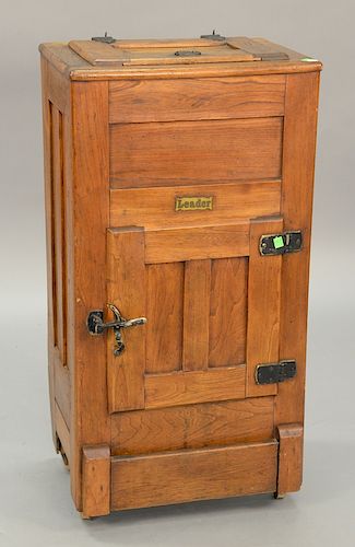 Diminutive Leader oak ice box with lift top. ht. 36in., top: 13" x 19"