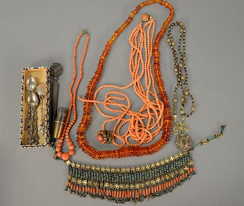 Group lot to include Peruzzi silver letter opener, coral single strand necklace, amber beaded necklace, multiple strand coral neckla...
