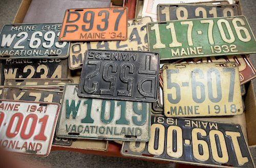 Two box lots of twenty-four vintage Maine license plates from the year 1918 to 1942.