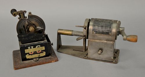 Two vintage pencil sharpeners including U.S. Automatic Pencil Sharpener Chicago circa 1900 (ht. 5in.) and a Dandy Automatic Feed Pen...