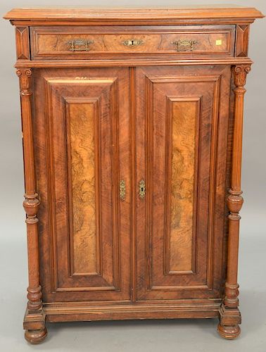 Victorian walnut cabinet having one drawer over two doors with burl walnut panels. ht. 56in., wd. 39in.