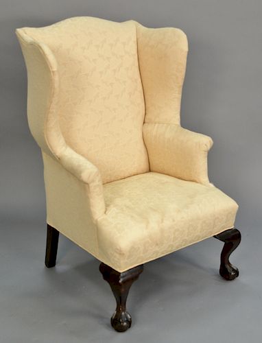 Two Chippendale style upholstered wing chairs.