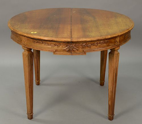 Italian style round dining table with carved apron stamped: "made in Italy" with leaves. ht. 29in., dia. 40in., with two 18in. leave...